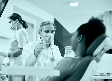 Dentist working with patient